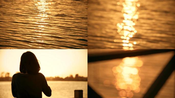 夕阳下金色水面美女拍照剪影
