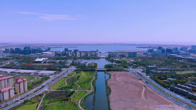 航拍蓝天白云远眺上海临港滴水湖远景空境