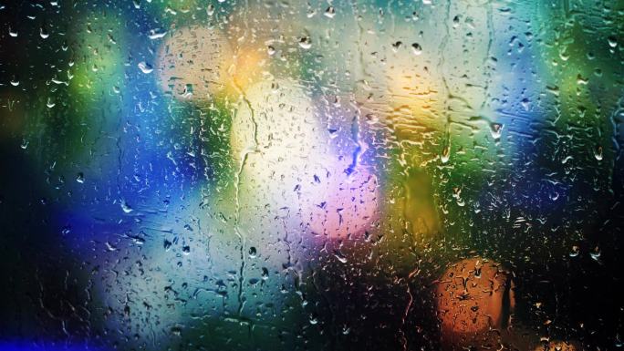 窗户玻璃夜雨雨滴城市霓虹