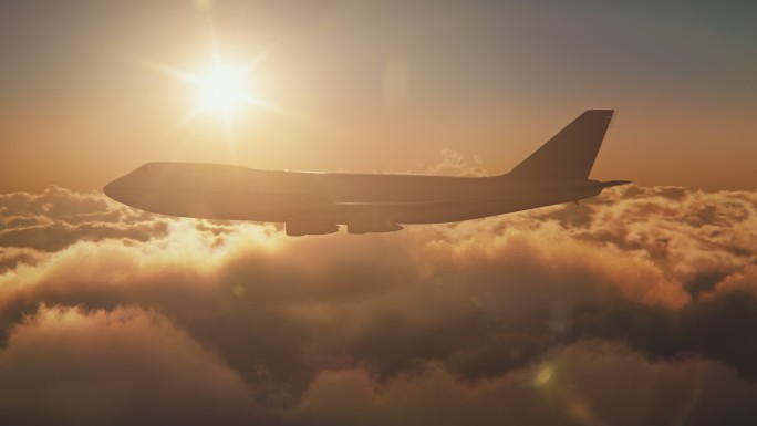 云层上的飞机飞机逆光飞越云层云上飞机