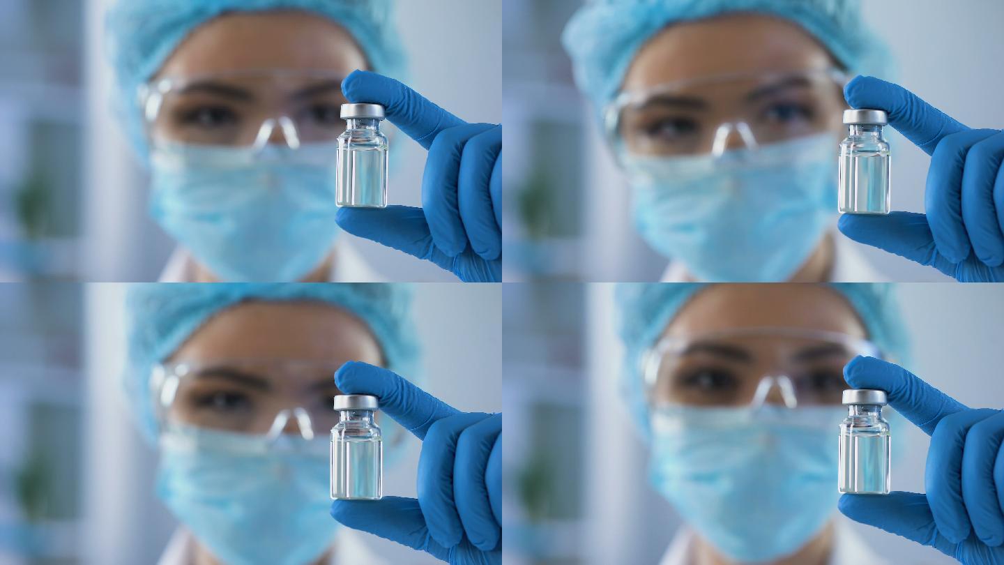 女科学家手拿安瓿制药工业制药机械医疗保健