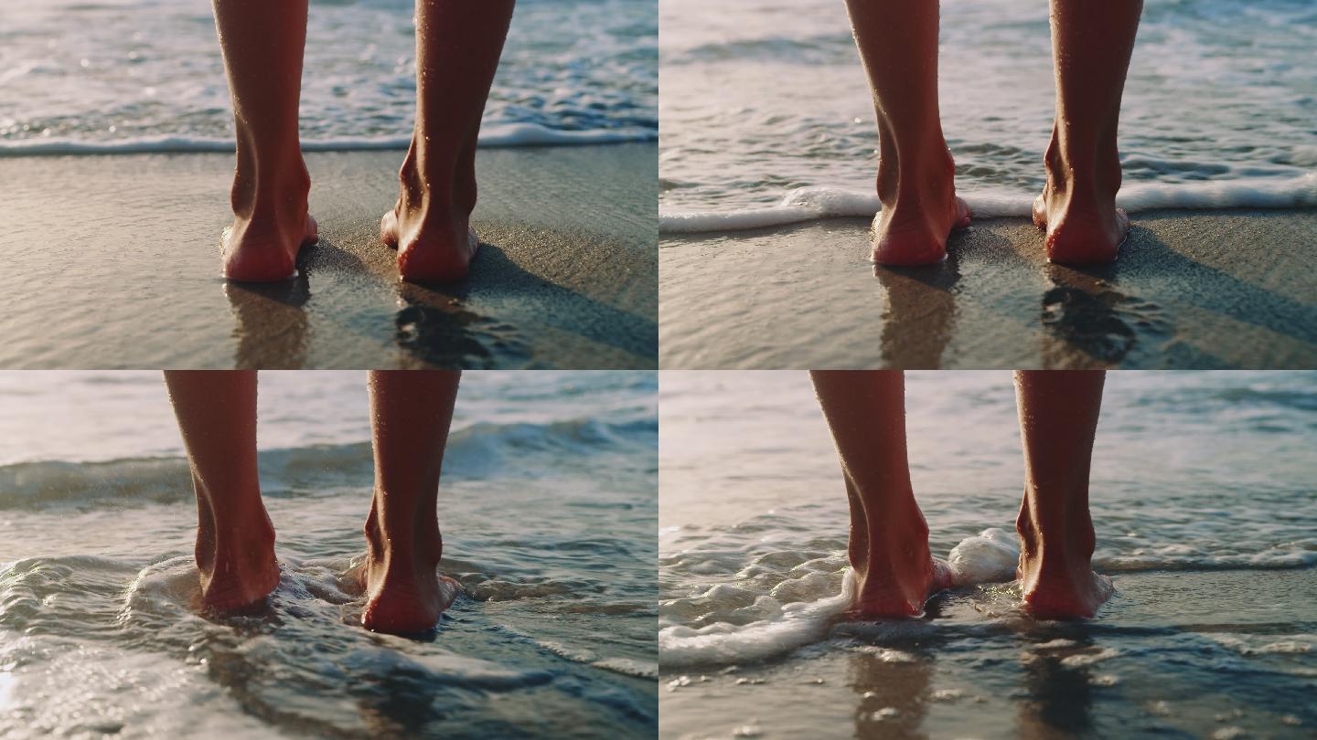赤脚站在海滩上的年轻女子