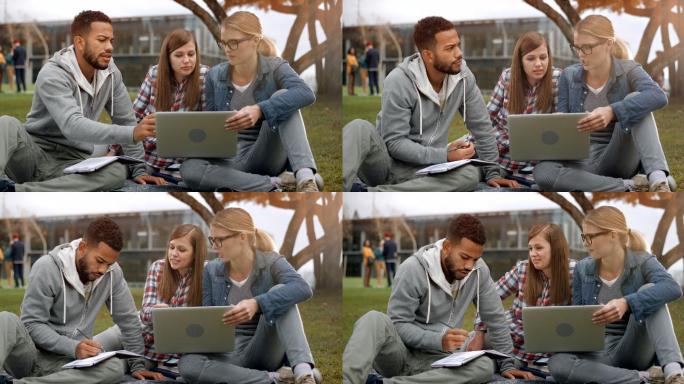 男生与两名女同学在公园学习
