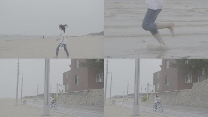 美女骑自行车海边跑步升格灰度
