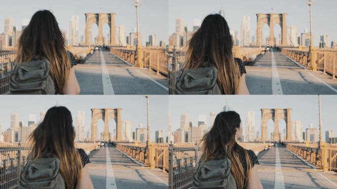 年轻女子在纽约布鲁克林大桥上行走