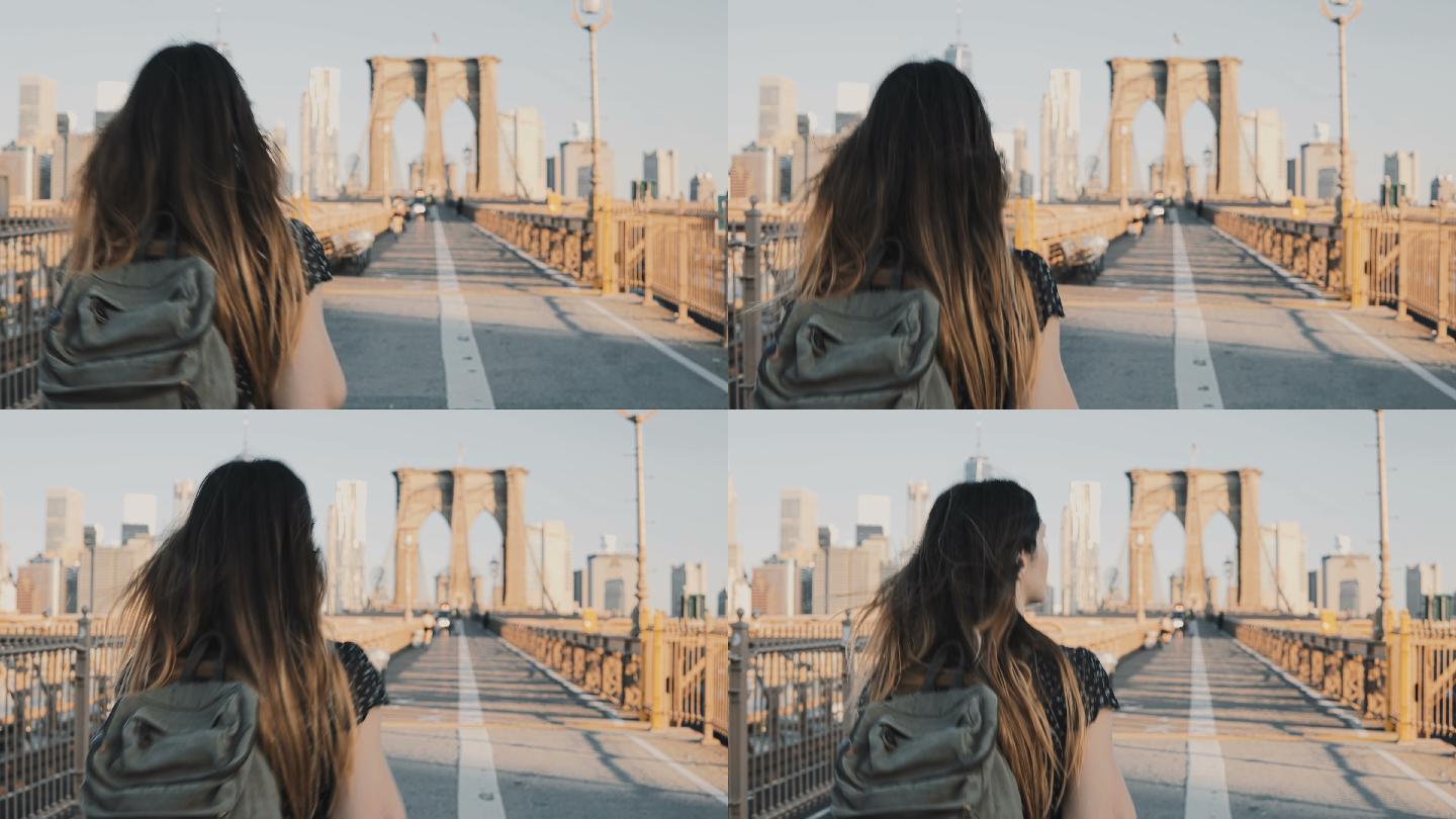 年轻女子在纽约布鲁克林大桥上行走