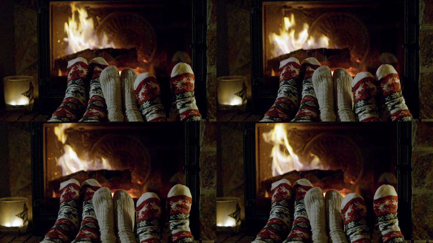 穿着舒适的圣诞袜在壁炉旁放松