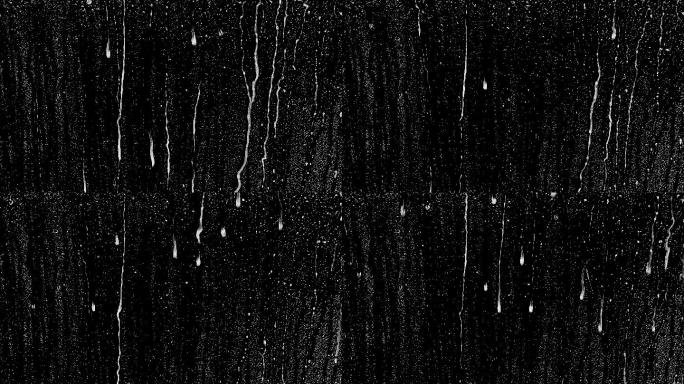 雨滴落在黑色的背景上