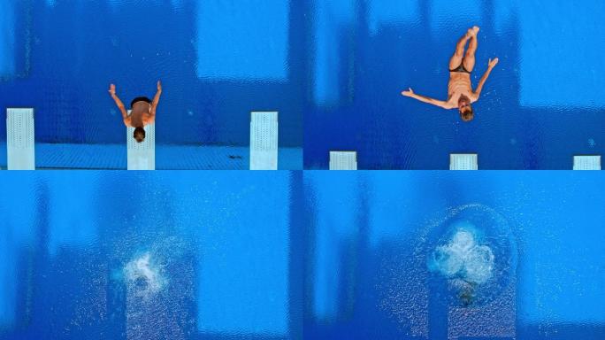男子运动员跳入游泳池时在空中做旋转动作