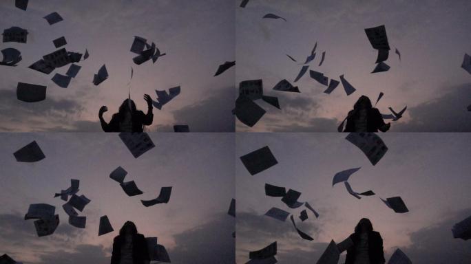 扔报纸纸屑碎屑碎纸书页扔纸毕业季毕业学生