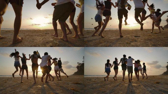 一群朋友日落时在沙滩上奔跑