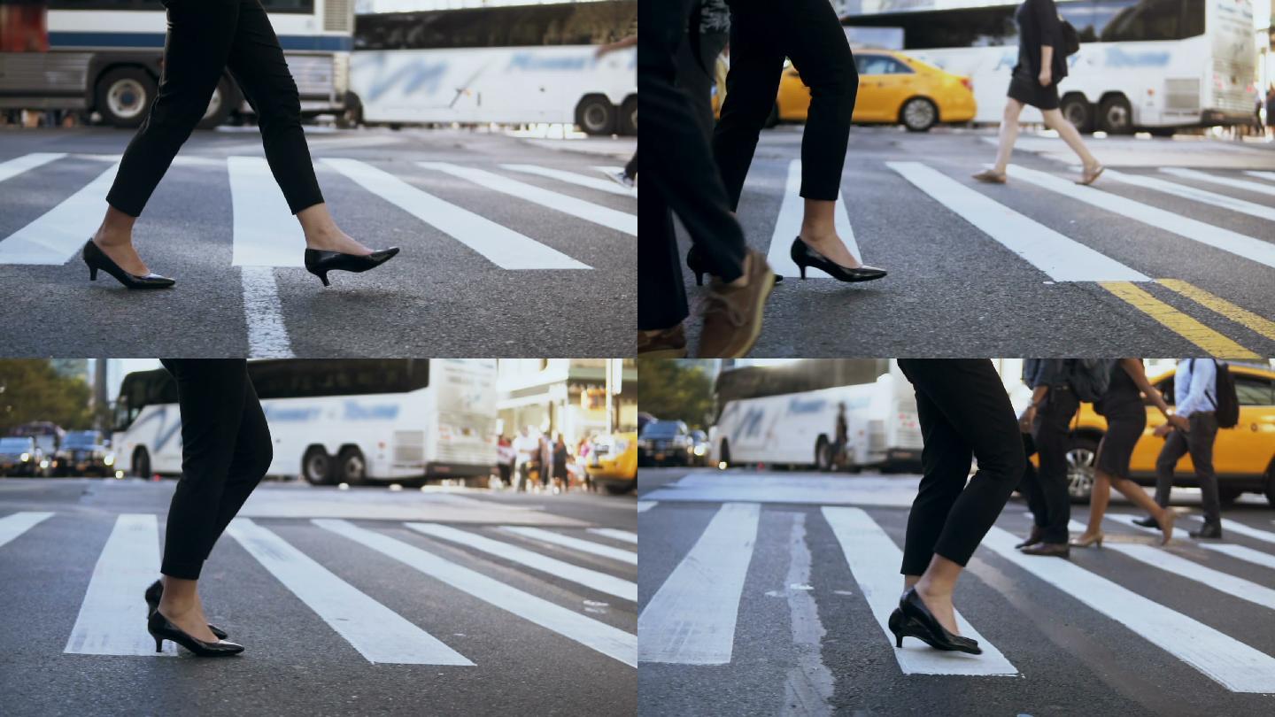 穿着高跟鞋穿过马路的年轻女商人的特写镜头