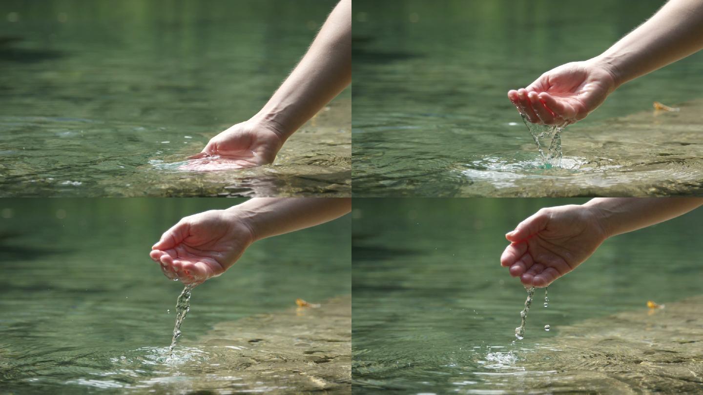 在美丽的山湖里用手玩清水