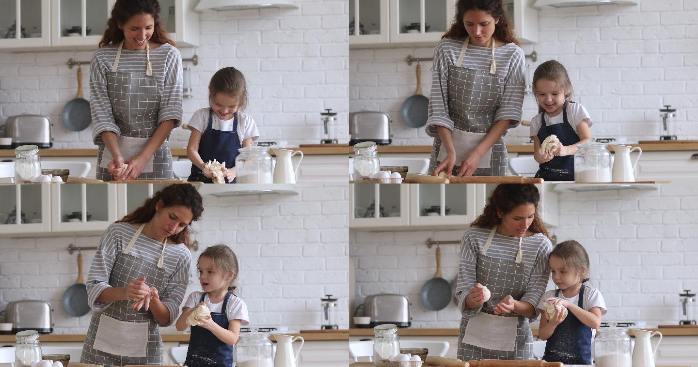 快乐妈妈教小女儿一起在厨房揉面团