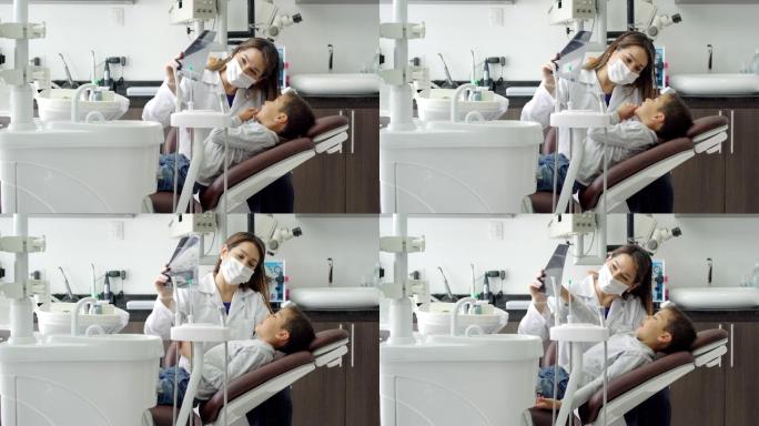 儿科牙医和她的小病人交谈