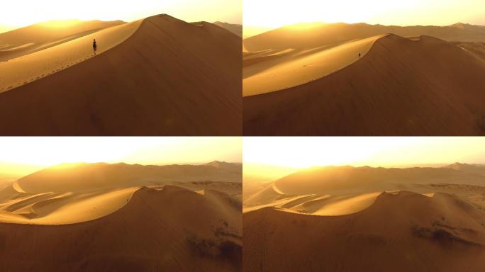 沙丘沙漠行走脚印一个人孤身沙漠夕阳日落徒