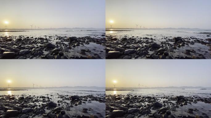 海边夕阳礁石风车阵
