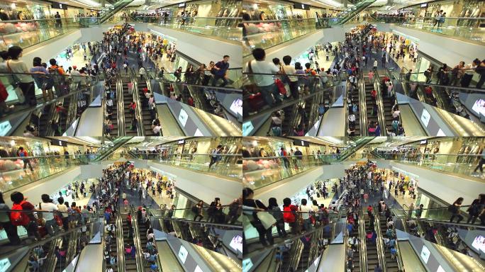 购物中心的自动扶梯上挤满了人。