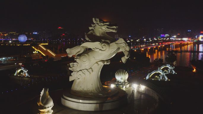 航拍广西防城港市龙马广场跨海大桥夜景