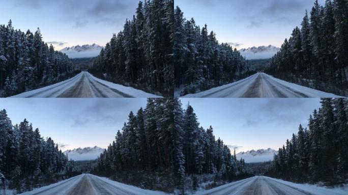 开车穿过国家公园远处的雪山公路自驾雪天开