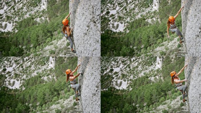 女攀岩者定位快速牵引和夹绳