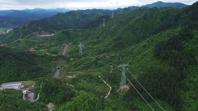 4K航拍高铁和高压线森林远景