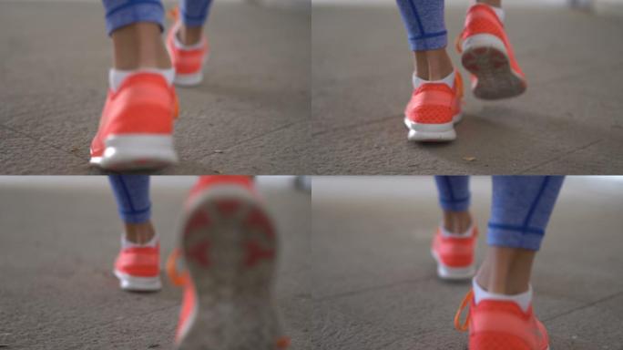 穿着运动鞋走路的女人
