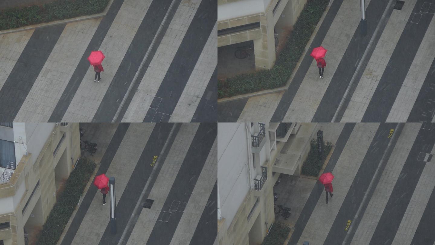 雨中撑伞的行人