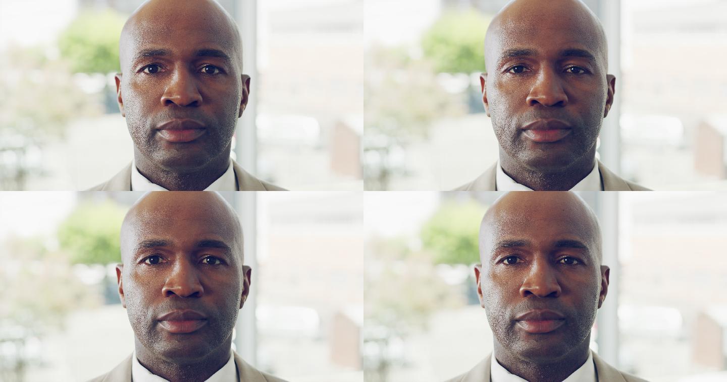 一个面无表情的男人注视着前方