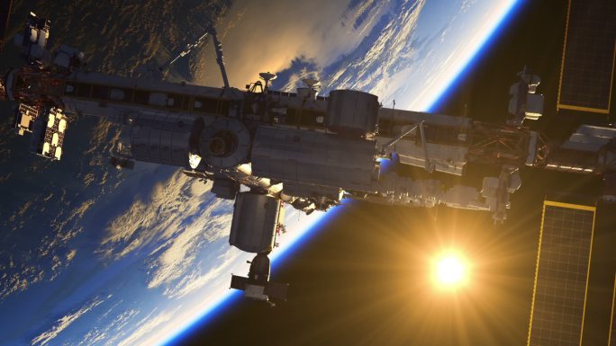 以地球和太阳升起为背景的国际空间站飞行。