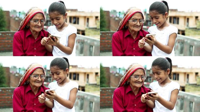 小女孩教老奶奶用手机
