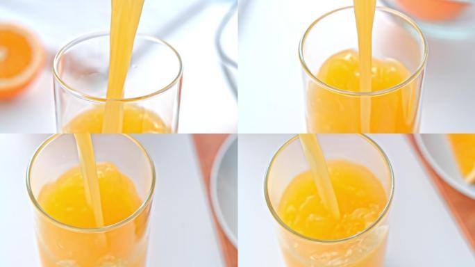 橙汁倒进杯子里