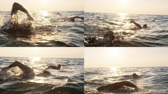 两名游泳运动员在波涛汹涌的海面上向前游泳