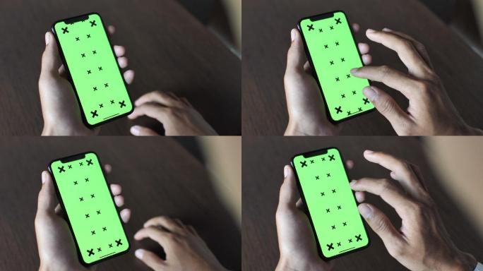使用绿色屏幕智能手机的特写镜头