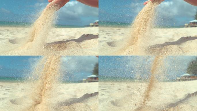 沙粒从手心坠落手捧沙沙子滑落洒落沙滩玩沙