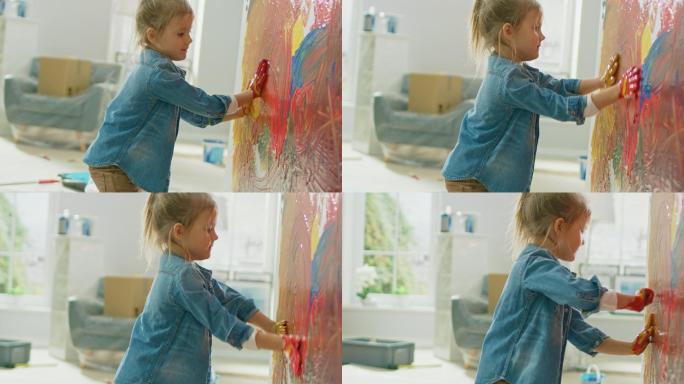 小女孩用鲜艳的颜料在墙上画出五颜六色的画