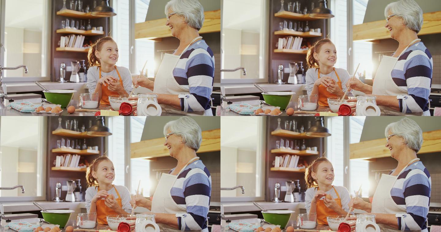 快乐的奶奶和孙女在厨房