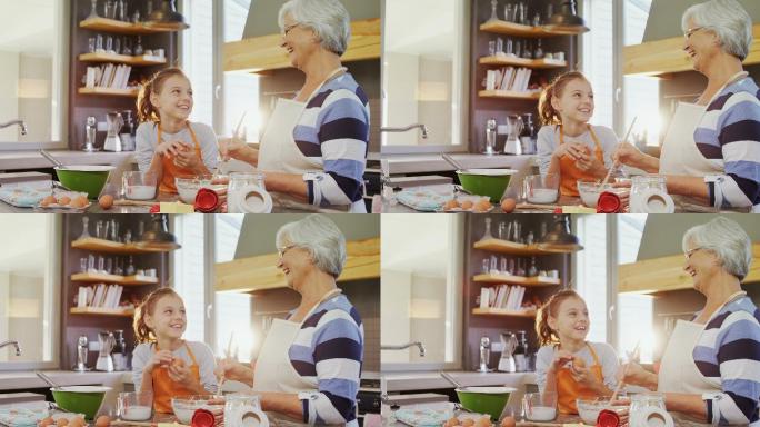 快乐的奶奶和孙女在厨房