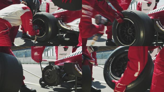 赛车队在赛车比赛中更换赛车轮胎