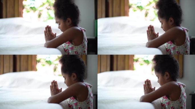 一个小孩在家祈祷婴儿亲子互动陪伴家庭温馨