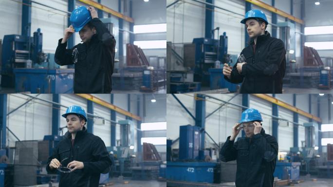 工厂工人边走边戴着安全帽和护目镜