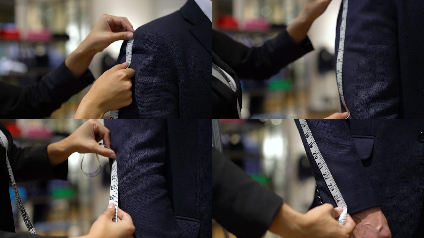裁缝在测量顾客西装的长度
