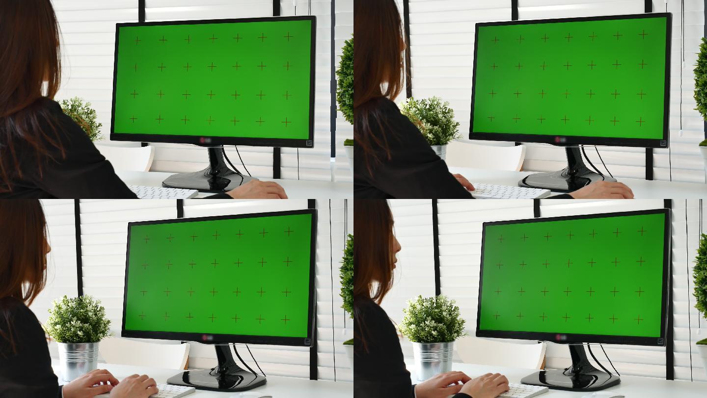 在使用绿屏电脑工作的女人