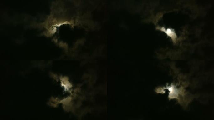 一轮圆月被乌云遮盖