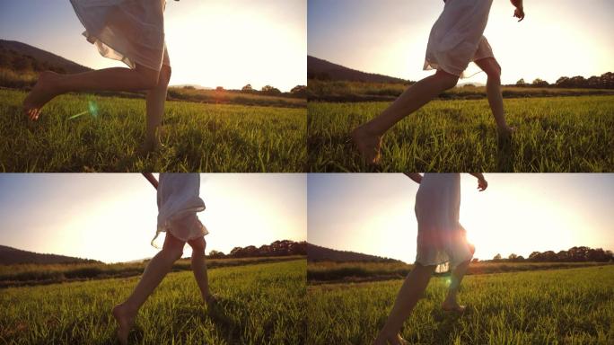 在草地上赤脚奔跑草坪草丛女孩小孩开心追梦