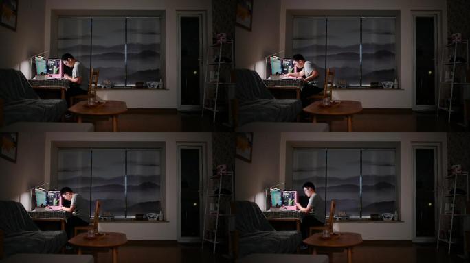 男子独自深夜电脑前伏案工作来回踱步固定侧