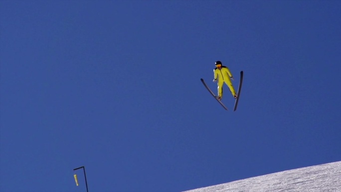 年轻人表演滑雪跳跃着陆