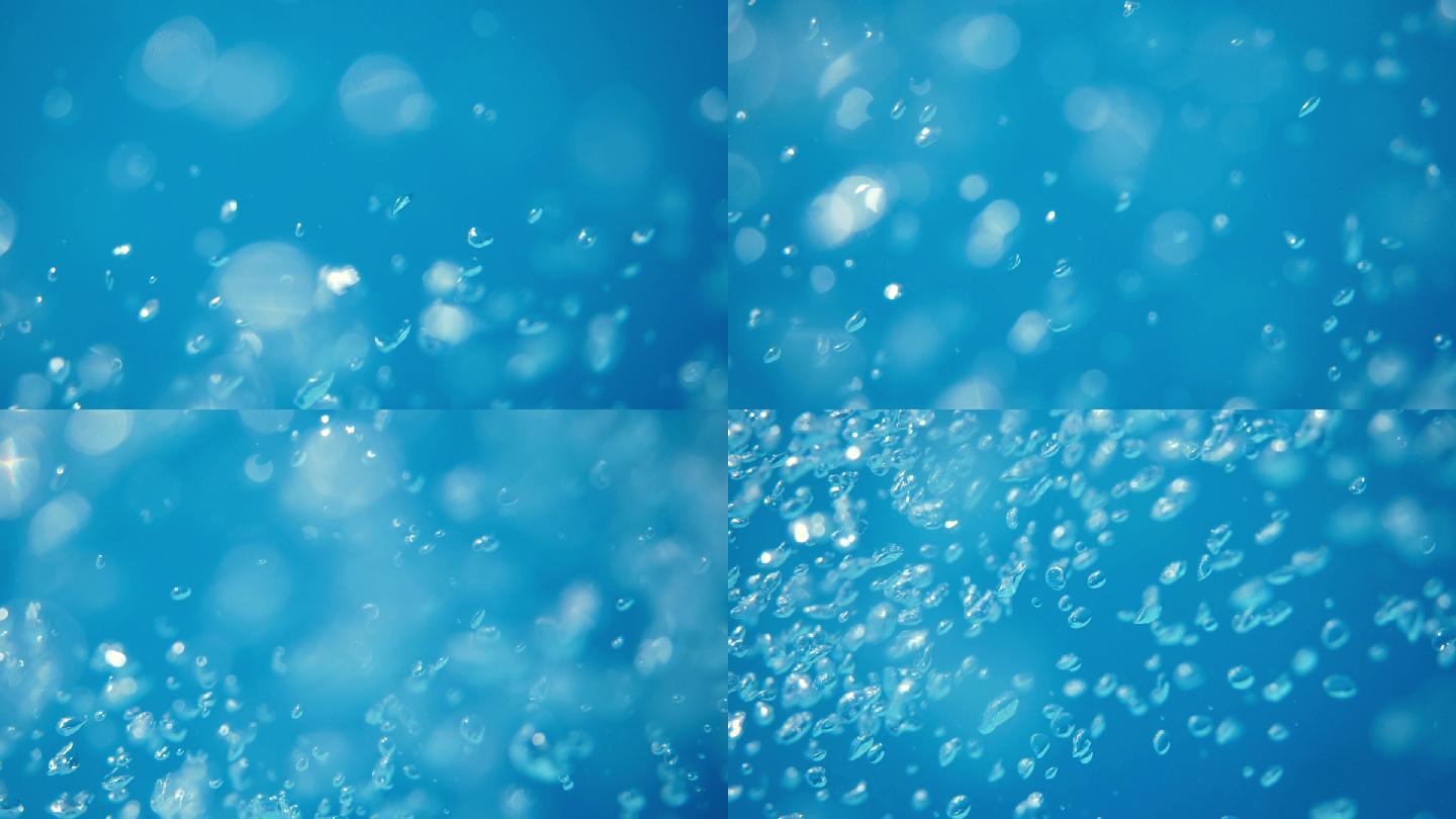 游泳池中蓝色清水中的气泡