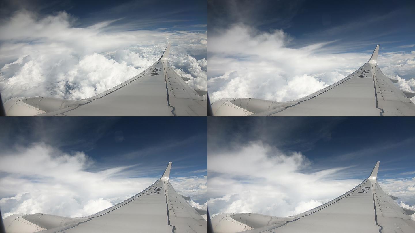 飞机天空白云航拍飞行机翼拍摄