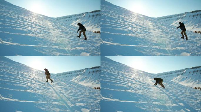 一个男人试图在光滑的冰冻雪地上爬山